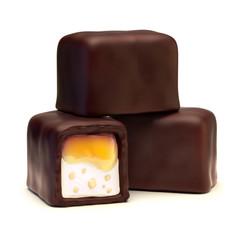 Chocolate candies with caramel filling, nougat and nuts crumb. Isolated on white background.