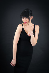Fototapeta premium Beautiful woman doing different expressions in different sets of clothes: pointing