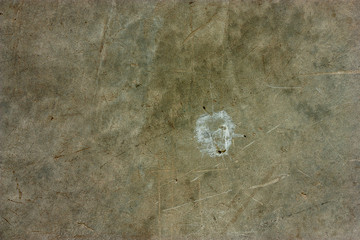 Cement floors are old and dirty.