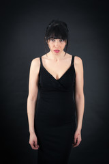 Beautiful woman doing different expressions in different sets of clothes: angry