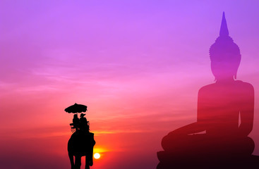 silhouette elephant and tourist with big buddha at sunset,visit