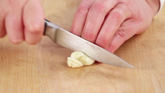 Garlic being sliced