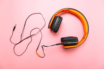 Headphones on pink background