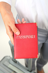 Fototapeta na wymiar Female hand holding passport, closeup