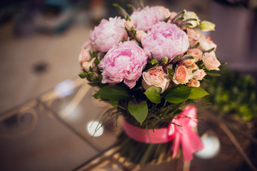 Bouquet of pink peonies  on table