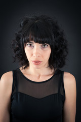 Fototapeta premium Beautiful woman doing different expressions in different sets of clothes: thinking