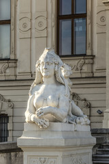 Fototapeta na wymiar Sphinx sculpture at Belvedere Palace in summer, Vienna