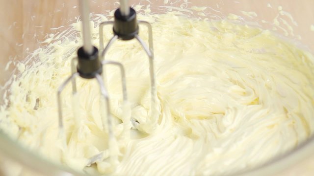 Butter being creamed with a mixer