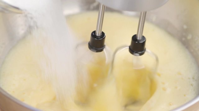 Sugar being stirred into egg cream