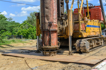 Fototapeta na wymiar hydraulic Foundation piles drilling machine on construction site