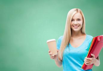 smiling student girl with folders and coffee cup