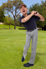 Mature golfer swinging his golf club out on the course