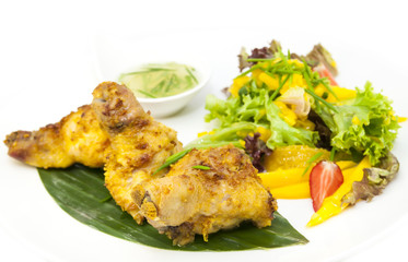 chicken in curry with salad and sauce 