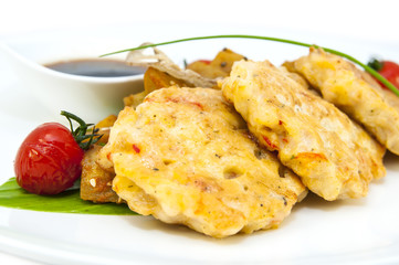 shrimp patties of meat with a salad of eggplant on a white background in restorne