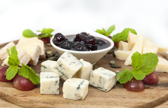 cheese plate with a large decorated the assortment of mint