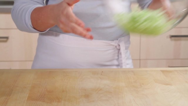 Grated cucumber in a piece of kitchen paper being wrung out