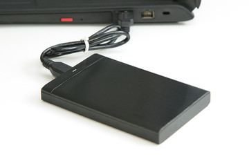  external hard disk connect to computer notebook on white.