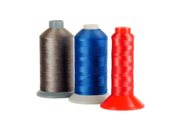 Three bobbins of  thread