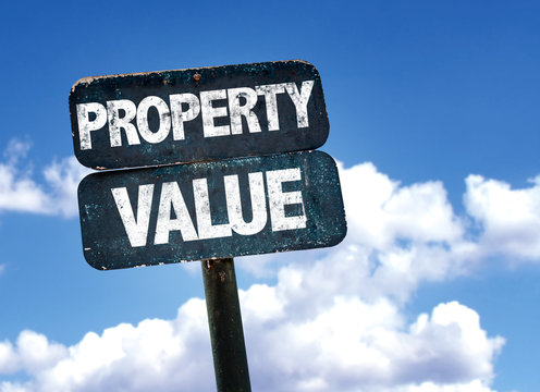 Property Value sign with sky background