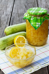 Sweet zucchini in sweet syrup on a wooden table