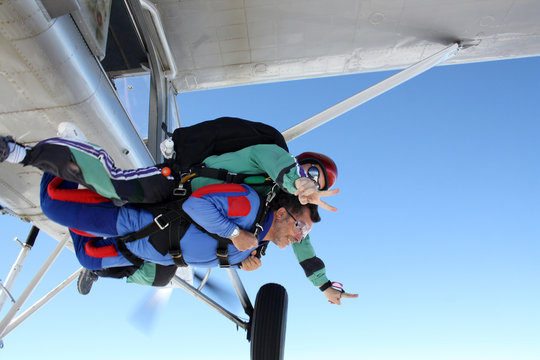 Skydiving tandem middle age man