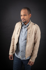 Handsome man doing different expressions in different sets of clothes: sad