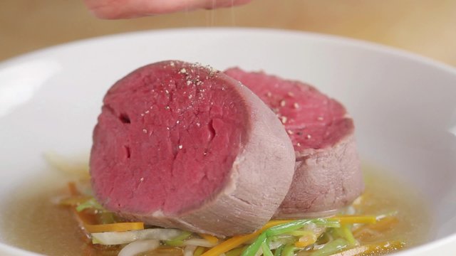 Seasoning poached fillet steak