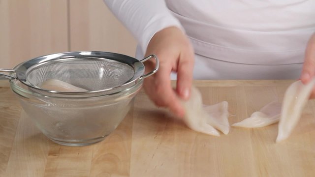 Patting calamari dry