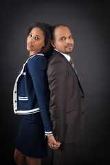 Handsome couple doing different expressions in different sets of clothes: back to back