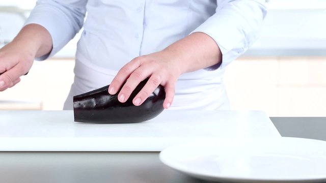 Aubergine being sliced