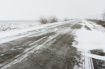 Winter landscape with empty highway and snow-drift in Ukraine