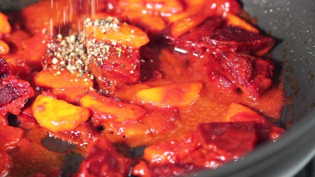 A beetroot medley being seasoned
