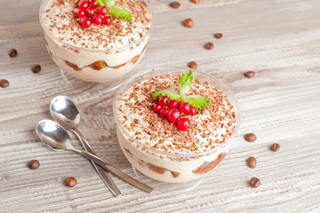 Tiramisu with red currant and chocolate in a glass, horizontal