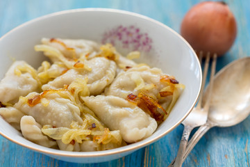 Dumplings with potatoes and fried onions.