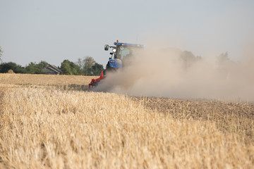 Fototapeta na wymiar Farmer in tractor preparing land for sowing 