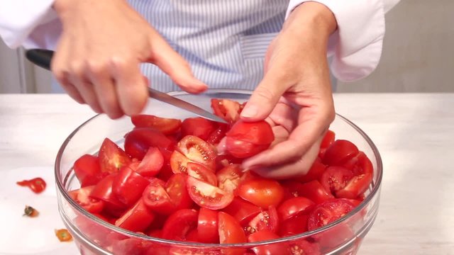 A tomato being quartered