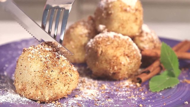 Plum dumplings dusted with icing sugar
