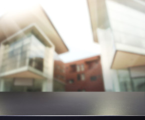 Table Top And Blur Building Background