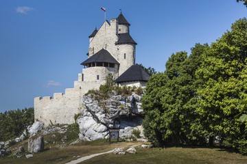 Fototapeta na wymiar Beautiful medieval castle at sunny day over blue sky, Bobolice,