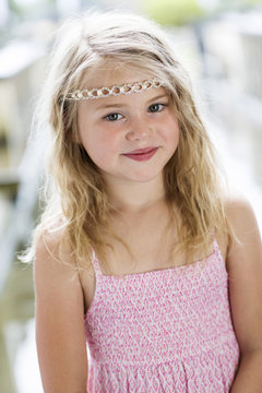 Portrait of smiling little girl wearing diadem