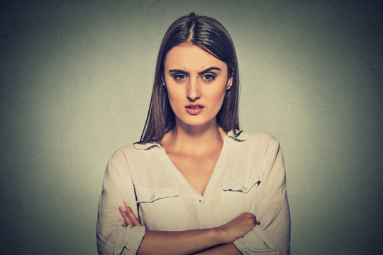 portrait angry displeased woman on gray background