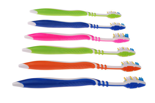 Colored toothbrushes. White background. (6 Clipping paths)