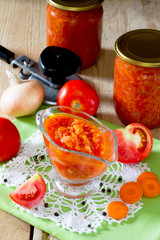 Tomato-onion sauce on homemade wooden background