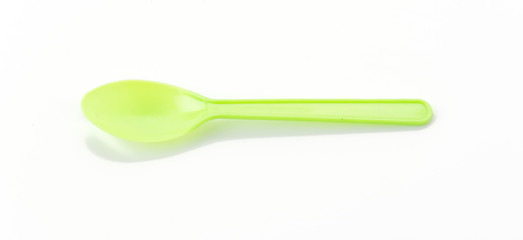 plastic spoon on white background