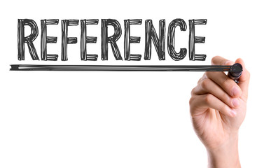 Hand with marker writing the word Reference