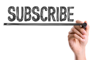 Hand with marker writing the word Subscribe
