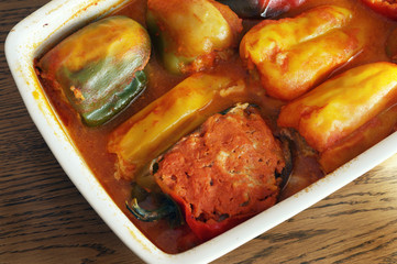 Bell pepper stuffed with meat in a white ceramic dish