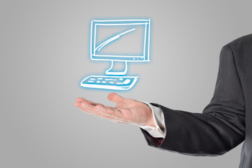 Businessman, salesman, computer symbol in the hand