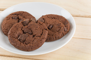 soft dark chocolate brownie cookies on wood