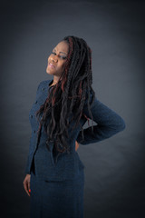 Beautiful woman doing different expressions in different sets of clothes: backache